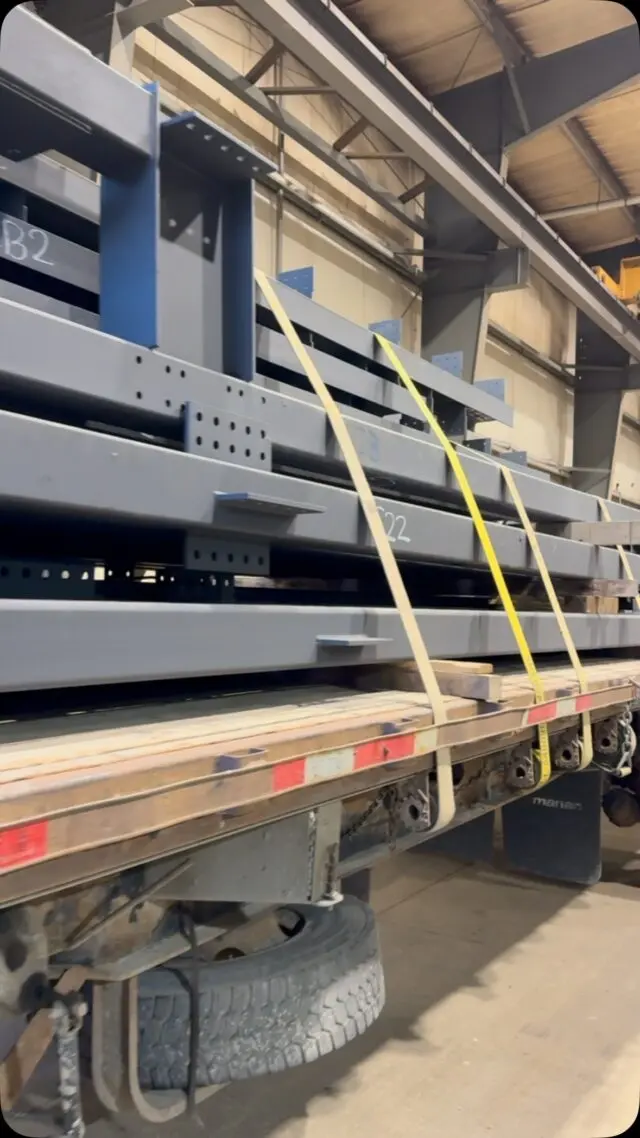 Steel beams strapped to a flatbed trailer