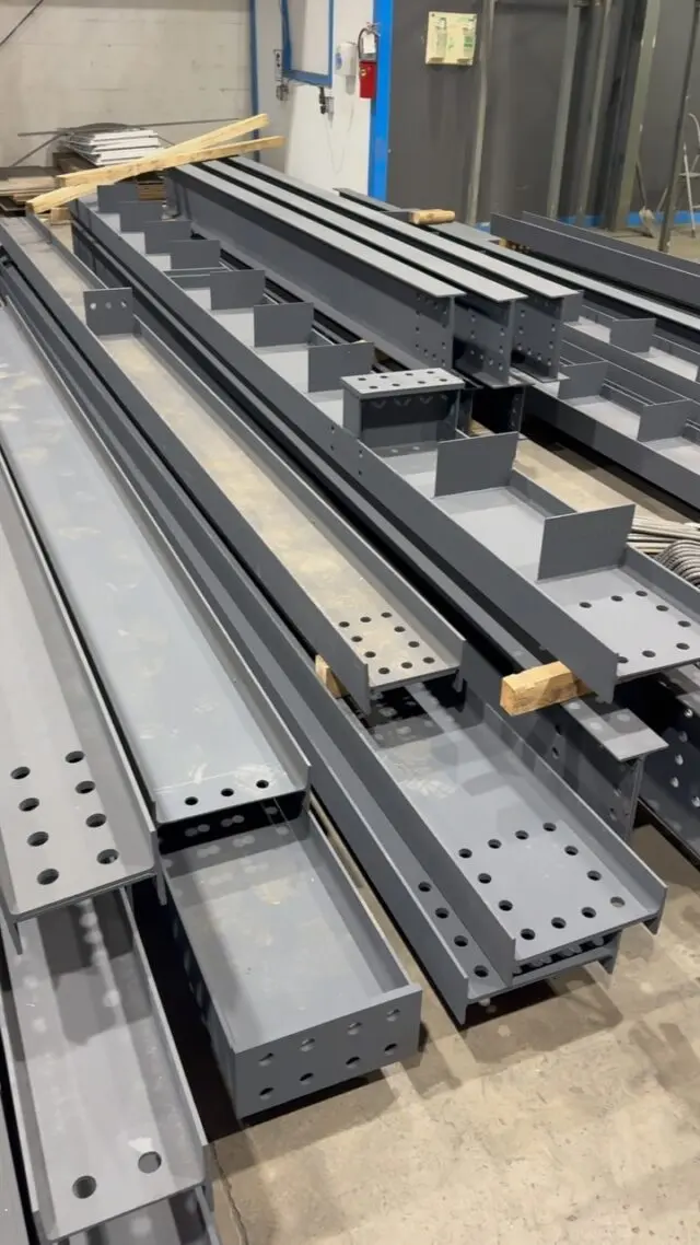 Fabricated steel beams with punched holes