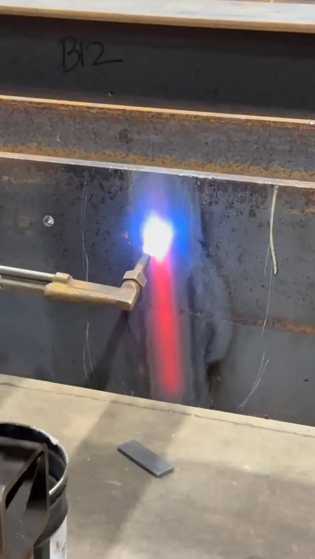 Torch cutting steel in the shop