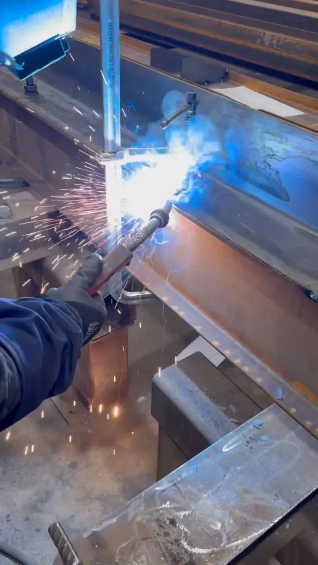 Welder working on structural steel